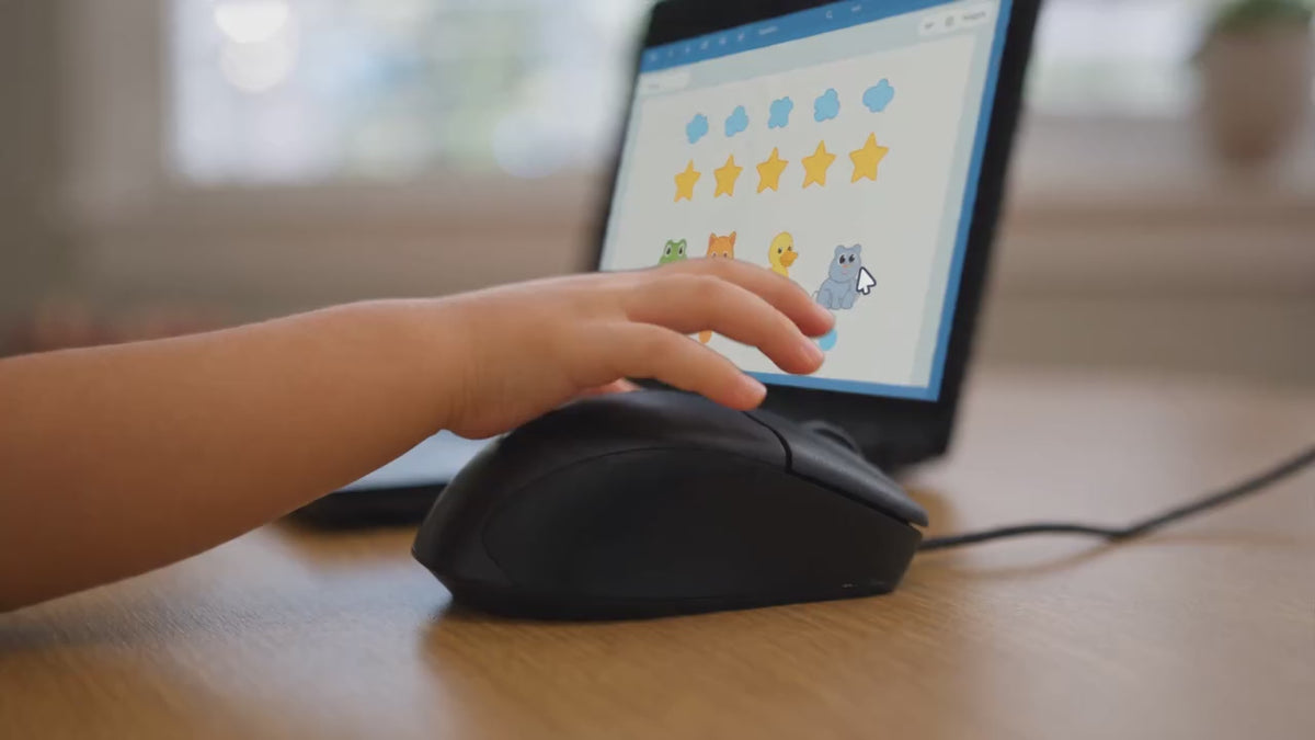 Video showing a child's hand using the My First Mouse wired computer mouse with a laptop, then plugging in the USB cable, ending with a product shot of the mouse and My Little Keyboard with the tagline "Wired for Little Hands."